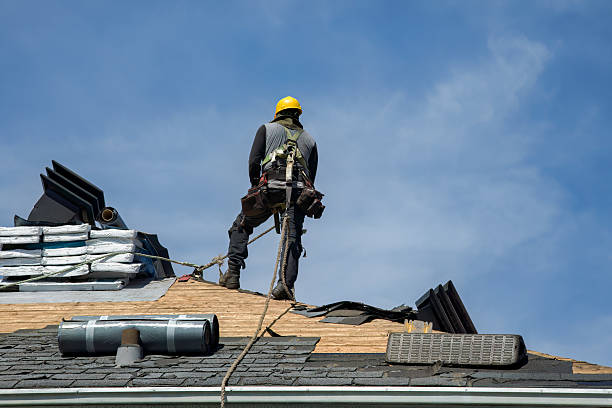 Professional Roof Replacement technician working in Columbus, KS
